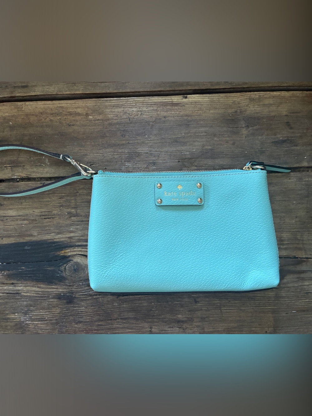 kate spade turquoise wristlet clutch with gold logo plate